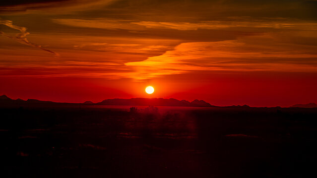 Beautiful sunrise in the Arizona desert with clouds and mountains