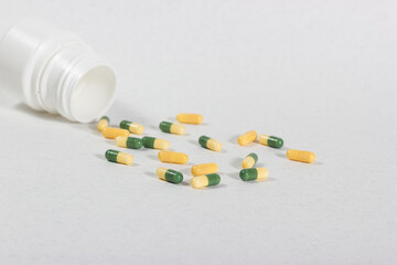 Medicinal tablets arranged on a white background.