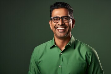 Fototapeta premium Happy smiling middle-aged businessman Confident professional businessman wearing colored shirt on gray background Advertising glasses lenses