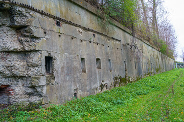 Fototapeta premium Bolestraszyce, Subcarpathian, Poland - 25 November 2023: Fort GHW XIII San-Rideau, the northeastern part of the left wing caponier and a fragment of the shooting gallery in the moat's counter wall