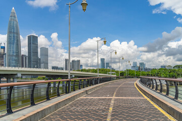 Park trestle in city of Shenzhen China,beautiful mix of green trees combined with buildings, modern architecture