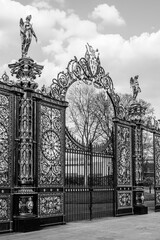 The Golden Gates, historical ornate Victorian gateway from 1862 located in front of the Town Hall in Warrington, Cheshire, England, UK; Text: "God gives growth" in black and white
