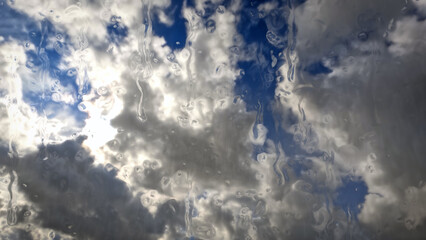 downpour on sky with clouds - cute weather backdrop - photo of nature