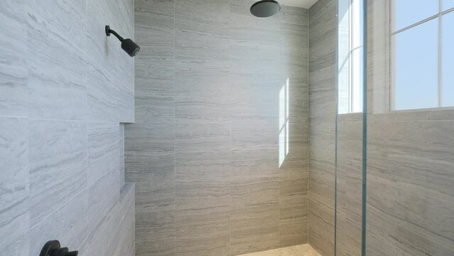 Contemporary minimalistic walk in rain shower with grey pattern tile, chrome plumber system, black bath rug and built in shelf for hygiene products storage