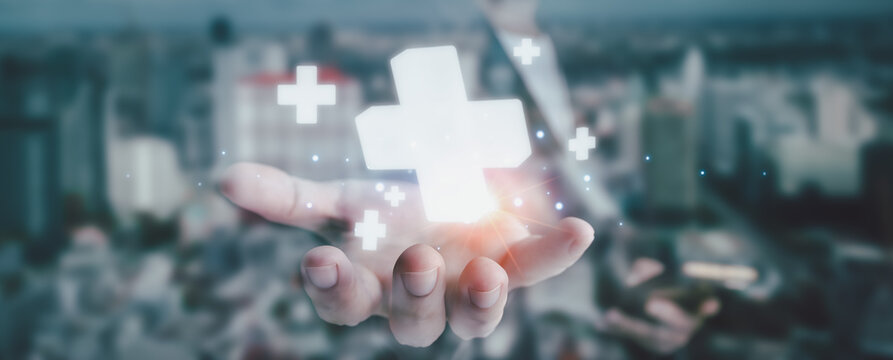 plus sign icon floating in the air on hand It symbolizes the introduction of positive elements such as personal development, social profit, health insurance and a growth mindset.