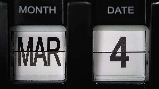 retro flip calendar with a date change from the third of March to the fourth of March. daily calendar with a change of days of the month. close up.