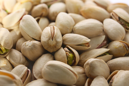 roasted pistachio nuts, food background