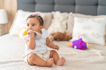 Thoughtful Baby Sitting with Toy