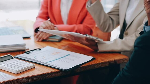 Team of business people are meeting to analyze data for marketing plan,Market research reports and income statistics, Financial and Accounting concept.