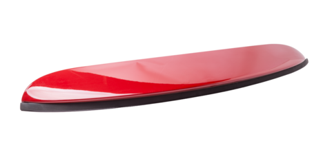 Red sports style spoiler for installation on the trunk lid on a white isolated background in a photo studio in a car repair shop for sale at an auto-parsing.