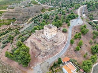 Aerial view of Torres Torres medieval castle ruin with square keep and semi circular towers near Valencia Spain with dramatic sky