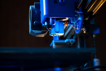 Close-up detail of the extruder of a 3D printer