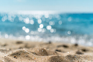 Sand and defocused bokeh and blur background of Sea, summer vacation, travel