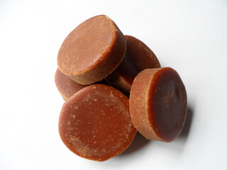 brown sugar or gula merah isolated on a white background