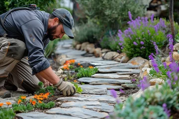 Foto op Canvas professional landscaper laying textured slabs for garden decoration with a big empty space for text or product, Generative AI. © Noobs