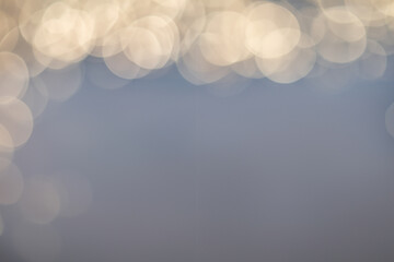 Abstract background of soft creamy bokeh circles.