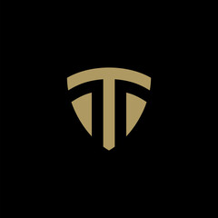 Letter T Shield logo gold color 