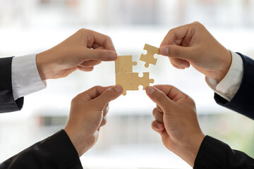 Concept of teamwork and partnership. Business teamwork puts the jigsaws team together cooperation unity concept represents team support and help. Charity, volunteer. Unity, team business.