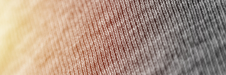 blurry grey knit fabric in zoomed in form as a background close up. defocused. banner. flare - Powered by Adobe
