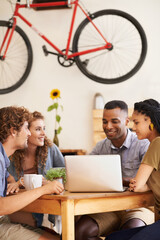Business people, planning and happy group on laptop in cafe for remote work in startup. Computer, diverse team or friends in coffee shop for collaboration, meeting or creative designers brainstorming