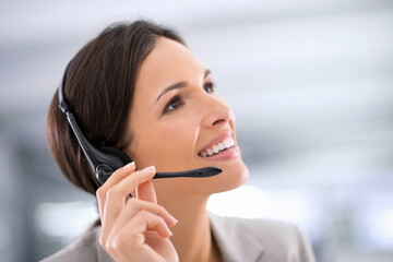 Businesswoman, customer service and smile with thinking in office for planning, communication and support. Agent, headset and mockup with vision for consulting, client and help for telemarketing