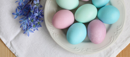 Easter concept, painted eggs in pastel colors. flat lay, top view. copy space.