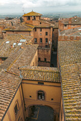 Fototapeta premium View from Duomo on narrow street in Siena, Tuscany, Italy