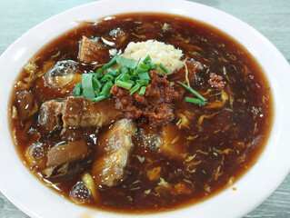 thick dark sauce of local noodle cuisine