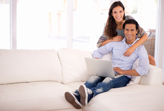 Portrait, relax and happy couple on sofa with laptop for internet, browse and search for movie subscription. Smile, woman and man on couch together on app for online streaming, love and entertainment