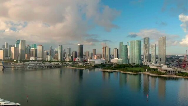 Aerial 4k shot of Miami skyline  day with yacht