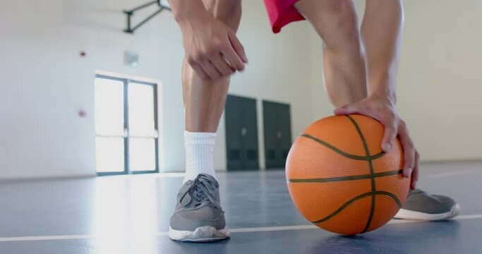 Athlete ready to play basketball in a gym