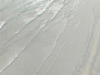 Aerial drone view of beautiful beach with turquoise sea water of Gulf of Thailand. Kood island, Thailand.