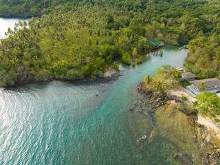 Obraz premium Aerial drone view of beautiful beach with turquoise sea water and palm trees of Gulf of Thailand. Kood island, Thailand.