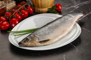 Whole raw salted herring fish