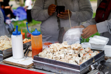 Indonesian street food dimsum or siomay, and illustration of hand putting siomay or dimsum into styrofoam container or box