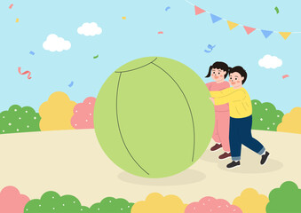 Children playing a game where they roll a big ball.