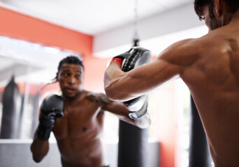 Man, boxing and personal trainer for workout practice in combat gym for competition endurance,...