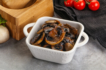 Roasted champignon mushrooms in the bowl