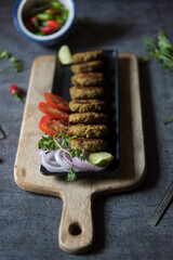 Close up of shami kebab or meat kebab on a tray. Selective focus. 