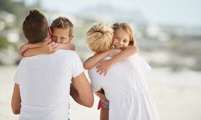 Smile, beach and children hugging parents with love on travel vacation, holiday or adventure. Happy, care and young kids embracing mother and father by tropical ocean or sea on weekend trip together.