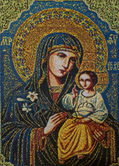 Naklejka premium A sewn, embroidered icon representing the Mother of God with the baby Jesus in her arms