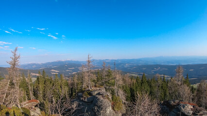 Scenic view from massive rock formation Grossofen surrounded by idyllic forest in Modriach, Hebalm, Kor Alps, border Carinthia Styria, Austria. Refreshing hiking trail in remote Austrian Prealps
