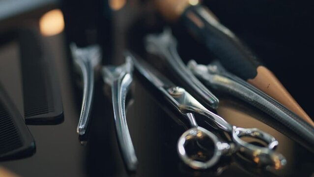 Closeup - Hairdressing scissors and barber accessories in hair salon, Professional tools for haircut in barber shop. Hairdressing concept