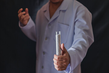 Man holding technology of recycled plastic pellets. Scientists and Polymer Products Love World. recycled polymer graphics. Environmental business.