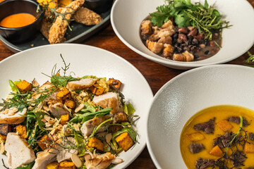 Starter, soup, salad and main course. Hotel meal. Delicious restaurant dishes. Several options.
