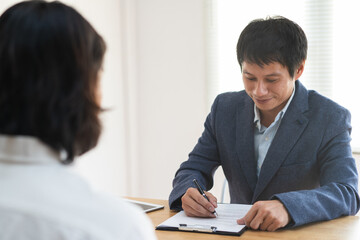 job interview concept. Businessman asking candidate applicant in interview room.