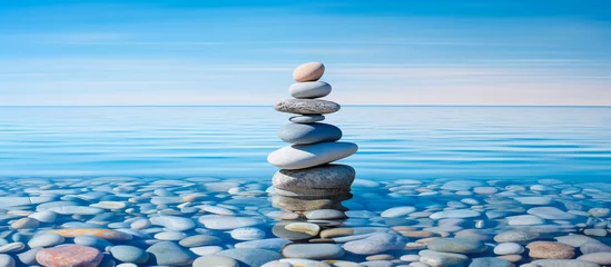 Gartenposter stack of pebbles rock,  serenity and calm concept background © Menganga