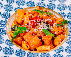 Penne pasta with tomato sauce close up