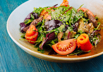 Warm salad with grilled meat and vegetables