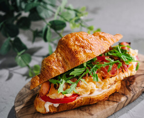 Fresh sandwich with bacon and scrambled eggs